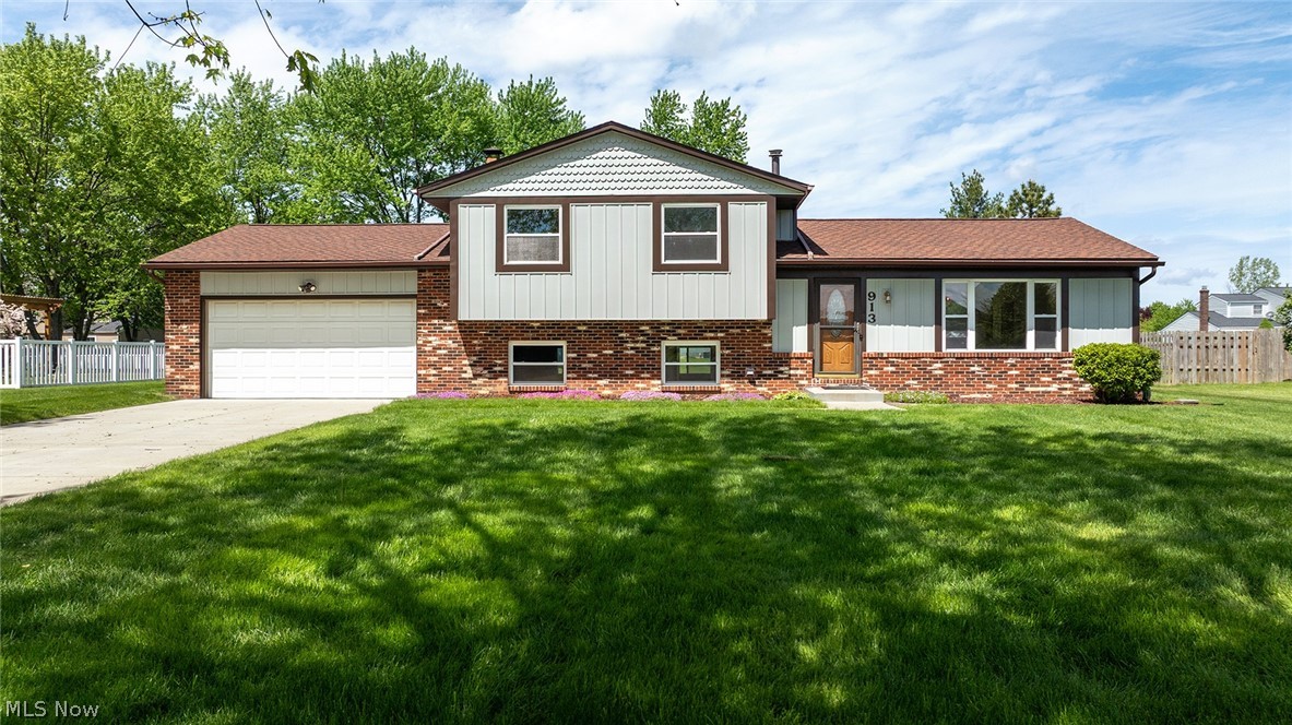 Welcome to this beautifully updated 4 level home in the heart of Macedonia, offering a perfect blend of modern style and functional design. The stunning open concept main level area features vaulted ceiling and luxury vinyl plank flooring, creating a bright and spacious feel ideal for both entertaining and everyday living. At the center of the home is a completely renovated chef's kitchen, showcasing quartz countertops, a massive island, a pot filler, and range hood vented to the exterior. The custom angular herringbone tile backsplash, pendant lighting, and recessed lighting add a high-end sophisticated touch throughout the kitchen, living, and dining areas. Both bathrooms have been thoughtfully updated. Main bath features a large walk-in shower, new vanity, updated fixtures, and LVP flooring.  The 2nd bath offers new vanity, toilet, tub, and custom tile surround, offering style and comfort to family and guests. Fresh neutral paint covers every surface, complemented by brand new carpet in all the bedrooms and the family room. New light fixtures throughout the home enhance the modern aesthetic and the updated electrical panel adds peace of mind. Major exterior improvements with the last 7 years include the roof, driveway, front, walkway, and front siding - providing excellent curb appeal and long term value. This move-in ready home combines quality updates, contemporary finishes, and an inviting layout all in a desirable location close to shopping, dining, and highways.