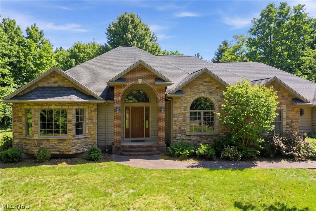 Don't miss this rare opportunity to own a custom ranch on acreage in one of Chardon's most desirable settings!
A stunning 2003 custom-built ranch nestled on 3 private acres at the end of a quiet cul-de-sac was designed for comfortable one-floor living. This exceptional home offers 4 bedrooms, 3 full + 1 half baths, a home office, eat in kitchen, full basement and quality craftsmanship throughout!

From the moment you step inside, you'll appreciate the custom finishes, thoughtful design, and spacious layout. Beginning with the grand foyer entrance with chandelier, the inviting living spaces are perfect for both everyday living and entertaining. While large windows bring in abundant natural light and showcase the peaceful surroundings, the high ceilings and stone wood burning fireplace create a cozy relaxing atmosphere in the living room. Dining room and family room with hard wood floors add to the spaciousness of this beautiful home.

A large master suite provides a private retreat with a walk in closet, large bathroom with double vanity, walk in shower, and jacuzzi tub. 2 of the 4 bedrooms are joined with a full Jack and Jill bathroom with double vanity. All bedrooms feature walk in closets and solid wood doors! You'll appreciate the additional main floor room that adds flexibility for a home office, study or playroom. The large full basement with higher than usual 9-foot ceilings presents endless possibilities for future finishing, recreation space, storage, or a workshop.

You can walk out onto the the composite back deck from the living room, kitchen and master bedroom to look into the beautifully secluded backyard surrounded by trees and nature. You'll also appreciate the convenience of an attached 3 car garage with one double door and second single door providing extra room for cars and storage, while the large driveway provides plenty of room for parking or play as well.