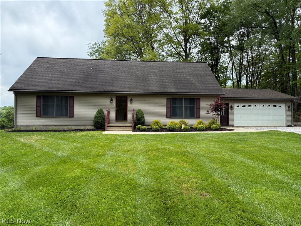 Uniquely, quiet location at wonderful Lake Buckhorn which features a near 2 mile long lake for skiing, fishing, swimming, etc. This home sits on a very FLAT LOT which is something that is quite unusual in the Lake Buckhorn community. The peacefulness and serenity of this home, especially the rear yard…it’s simply wonderful. With bushes across the back, untouched wooded lot to the north of the house, (part of the property) and a 71 acre farm to the rear, it is heavenly. This home is located on a street that is a loop street which has ONLY 5 Homes and a serene ravine to the south of the loop.  If you yearn for quiet solitude, combined w the comforting security of having neighbors nearby but not too close, this is a home that you should look at before it’s gone. It lives larger than looks. The home features a 1st floor master suite w en suite bath & walk-in closet. There is a 2nd FULL Bath & a den/bedroom on the 1st floor along w the large Eat-In Kitchen w ISLAND & nice sized living rm. The windows of nearly all of rooms feature views of nature not neighboring homes. Upstairs, there are 2 bedrooms, 1 large & 1 extremely large featuring two wide closets and a FULL Bath + large area that could be a computer/study room between the 2 bedrooms. It’s a 4 BEDROOM, 3 FULL Bath home though the one bedroom (w ADJACENT FULL BATH) on the 1st floor may be used as a den. The kitchen is spacious & extremely nice w the popular WHITE Cabinets, ISLAND, large dining room-sized Eating area w sliders out to the deck and terrific views from the window over the kitchen sink and the sliding doors in Eating area. I’m sure the new owners will spend a great deal of time on the 20 x 10 deck in the rear of the house off of the Eating area. It is a very serene, peaceful & beautiful spot to spend your time w your morning coffee or relaxing in the evenings. There is a very spacious 24x24 garage off the laundry room & FULL unfinished basement waiting for your plans to fit you best. Call today