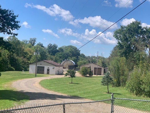 If you need space for your business and/or to build a new house with convenience to freeways and all of Wayne County, here is an opportunity you don't want to miss. This 4.16 Acre offering has large buildings with office, storage and vehicle bays. The large pole building is 40 x 104 with a condition space for storage and office as well as three very large vehicle bays, a full bath with shower and washer dryer hook ups. The front cement block building is 18 x 36 with plenty of storage, one large bays and 480 power. The property also has a 44 x 60 Canvas covered building with a cement foundation. The property is currently the Doylestown Street Garage and city services.  The large canvas will go with the move of the city services, but the cement foundation will remain. This property is currently zoned R1, but the Village will rezone to Commercial Business based on buyer's needs. Offers can be made on this property individually or in conjunction with contiguous 42.72 Acre parcel with frontage on St. Rt. 585. See MLS 5227220 for more details on 42.72 acre offering. All 46.88 Acres are eligible as a Community Reinvestment Area which can provide as much as 100% discount on property taxes for up to 15 years.