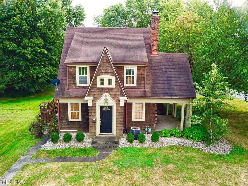 A Magical Home of Your Dreams! This home wraps its arms around you and pulls you in every direction your eyes can see! Charm, charm, and more Charm! Every room has a special detail.  3 Bdrms, 1.2 bath, Chefs Kitchen, w/concrete counter tops, formal dining room, Living Rm w/ coffered ceiling, gas fireplace & built in book case. Hard wood floors in most rooms and newer ceramic in kitchen. Basement has finished rec room area 12x24. Beautiful enclosed stamped concrete patio, covered porch, dog run, 2 car detached garage & shed. Total of 3 lots. Homes like this seldom come on the market. Call today for a private showing.