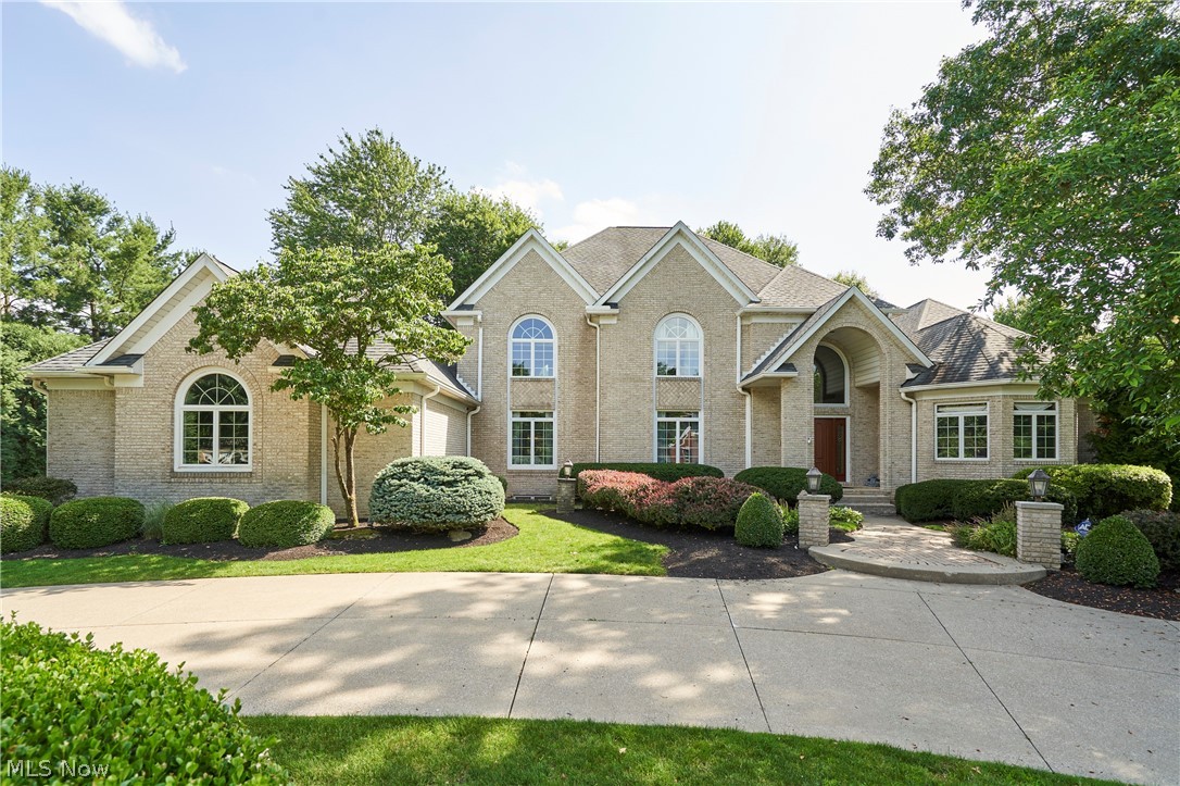 Welcome to this 4-bedroom, 5 full and 1 half bath home located in the highly desirable Crystal Shores development in Bath Twp, within the top-rated Revere School District. This exceptional home offers both luxury and functionality, beginning with a dramatic two-story foyer flanked by a private office and a formal living room with fireplace, which flows seamlessly into the formal dining room with fireplace, perfect for entertaining. The chef’s kitchen features a large 11-foot-long center island, top-of-the-line appliances, walk-in pantry, and an open-concept design that connects effortlessly to the inviting Great room with fireplace and a 19-foot ceiling, as well as direct access to the large stone patio & backyard, providing the perfect space to relax year-round. First-floor owner's suite with 2 walk-in closets. A half bath and laundry room complete the main level. Upstairs, the home features three spacious bedrooms and three ensuite full baths. The finished lower level adds even more living space, with over 3,000 square feet, complete with a large rec room, golf simulator room, theatre room, exercise room, and an additional full bath.  4-car garage with circular driveway. Additional highlights include public water and sewer, and access to Crystal Lake, which is just a short walk away, where residents can enjoy fishing and non-motorized boating, such as canoes and paddleboards. Schedule your private showing today!