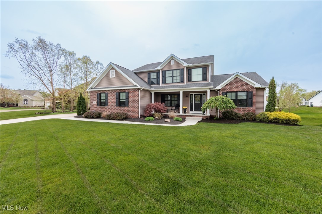 Your dream home has finally come available.  This truly open concept 4 bedroom 3.5 bath colonial is absolutely stunning with high end everything.  The 2 story Great Room has a wall of windows with amazing natural light.  An eat-in kitchen has a center island, granite counters, gorgeous back splash, ample cabinet space, and opens to a formal dining room.  There is A first floor master suite with vaulted ceilings, double sinks, a soaking tub, walk-in shower, and huge closet space.  Rounding our the first floor is a large laundry room, open foyer, and powder room.  The remaining upper bedrooms are very spacious and great closet space, with one bedroom having an absolutely giant closet.  An additional 1300+ square feet is available in the walk-out basement with a family room, rec room, 14x11 office/media room, a full bath, and a full bar.  There is also ample storage available.  The stunning exterior begins with a nature stone walk way and front porch.  To the rear find a deck off the main level with a retractable awning, and a very large patio area off of the basement slider.  The yard is a great size.  This home is on a cul-de-sac as well.