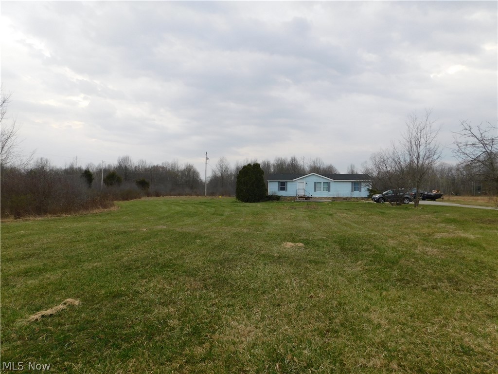 Three bedroom and two full bath home on five acres. The living room & dining room has beautiful laminate flooring. The spacious master bedroom has a walk in closet and full bath. The kitchen was updated in 2014 and has gorgeous backsplash and an island you can use as an eat in kitchen if desired. The backyard is wooded in the back of the property. The driveway has ample parking and turn around. There's a shed for outside storage. The front yard is secluded from the road & the driveway has apple trees beside it leading up to the home. Mineral rights transfer. Propane tank is leased