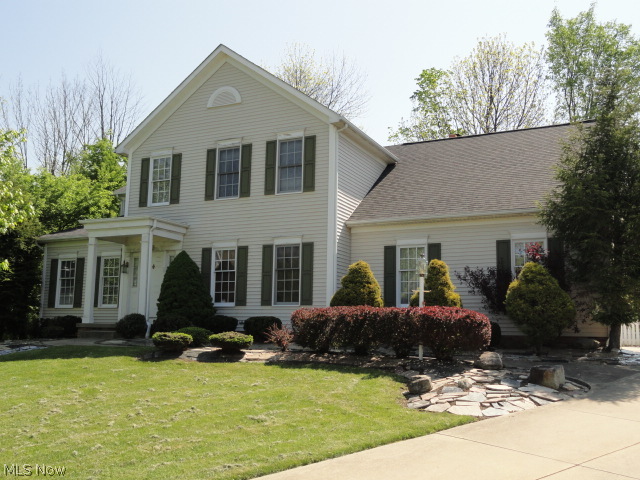 Situated in Village West of Hudson, this elegant traditional style Colonial is quality built w/custom features throughout.  Two story foyer entry w/hardwood flrs that continue throughout the entire 1st flr.  Impressive office w/built in cabinets w/rich wood molding and trim.  The formal living rm & formal dining rm are spacious, open and bright.  The huge kitchen has cherry cabinets, granite counters, breakfast bar plus a dinette, all open to the family rm w/skylights, fireplace and sliders to patio, backyard and gazebo w/hot tub! The double sided open staircase leads to a large loft area and 4 bdrms, 3 full baths.  All countertops are gorgeous high end granite.  Master suite w/cathedral ceiling, double walk-in closets & glamour bath offering a jetted tub, double vanity & separate shower.  Lower level has a large rec rm w/possible 5th bedroom & a 4th full bath.  Home sits high on a cul-de-sac lot and from Village West you can bicycle to downtown Hudson!  Home warranty included too.