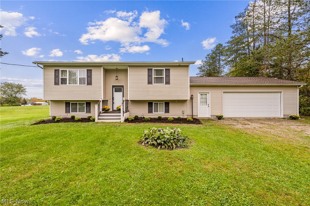If you are looking for country living with 1.5 acres of gorgeous land to enjoy PLUS quick accessibility to highways, restaurants and shopping....then this house is for YOU!  Meticulously maintained, updated and MOVE-IN ready spacious bi-level home just waiting for its new owner!  You'll enter via the newer Trex stairwell (2016) through the gorgeous, exterior door w/decorative glass inlay (2014)!  Up the stairwell you'll find a spacious living room w/large picture window, and an electric fireplace, perfect for cozying up on the upcoming cold fall nights!  The dining room features laminate flooring and a sliding door that leads to the newly restored deck (2021) and backyard!  Nice size kitchen w/plenty of oak cabinetry, newer hardware and center island!  Large master bedroom w/fireplace and a HUGE bathroom w/large linen cabinet complete the first floor!  Down the stairs you'll find a lovely family room, perfect for movie or game night w/a fireplace too!  Two generously sized bedrooms and