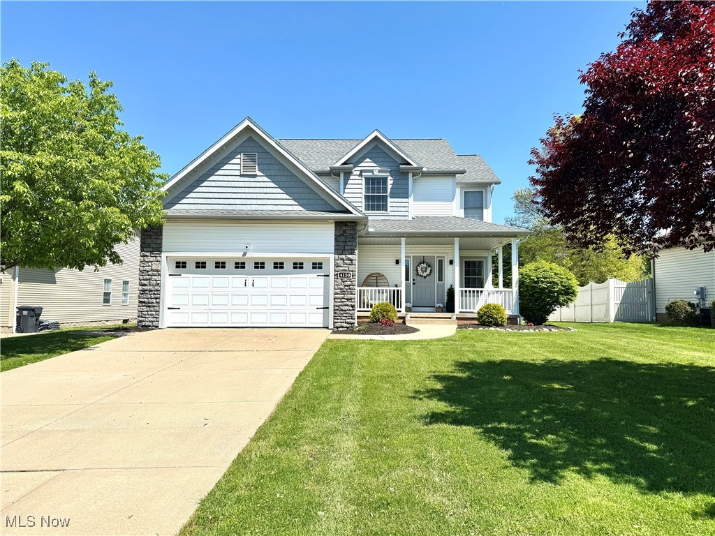 4130 Pembroke Drive --- 4 bed | 3 bath boasting over 2,800 sqft of bright & cheerful living space. Custom built by Hartland Homes. Curb appeal is instantly inviting with shaker & stone accents and a cozy covered vinyl front porch. Step inside and be greeted by the spacious foyer, coat closet, 9-foot ceilings throughout the whole main level & durable LVP flooring. Dining room flows seamlessly right into the stunning recently renovated kitchen-- featuring custom soft-close floor to ceiling cabinets, quartz countertops, peninsula, backsplash, a pantry & equipped with stainless KitchenAid appliances all centered around a farmhouse sink. The living room features a stone gas fireplace, recessed lighting and an abundance of natural light. There's also a convenient half-bath and a laundry room with cabinetry, a wood countertop & a utility sink. Upstairs boasts all four bedrooms and 2 full bathrooms. The primary ensuite is a true retreat with an expansive layout, dual vanity, soaking tub, and a walk-in closet. The finished basement has so many possibilities and currently serves many purposes & has an egress window, storage closet & a storage room. Step outside to your own oasis with a full vinyl fence w/gate (2021), concrete patio, pergola (2023), storage shed (2021), garden boxes and a playset! You'll love the 2-car attached garage, complete with a handy bump-out for extra storage. Other updates: HVAC/HWT (2022), Roof (2017), Finished Basement (2023), Full house humidifier (2023), Govee Exterior Lighting (2024). Field Schools. Brimfield Twp. Tucked away in a neighborhood with sidewalks yet in a central location within close proximity to all amenities such as the Library, Restaurants & Shopping. Seller is offering a 1 year America's Preferred Home Warranty for peace of mind. Your opportunity is now, don't wait!