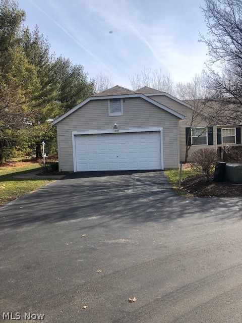 Gorgeous 2 bedroom with possible 3rd bedroom/2 bath condo on quiet park like setting.  This home has it all: 2 car attached garage, gorgeous layout with vaulted ceilings, oversized master suite, 4 season sun room with slider doors overlooking a fabulous deck and wooded lot, large open kitchen, first floor laundry, and fully finished basement.  The neutral decor and abundance of natural light expand the grandeur of this lovely home. This lower level includes an office, eating area, living room with fireplace and a possible 3rd bedroom.  This home is a must see and priced to sell.