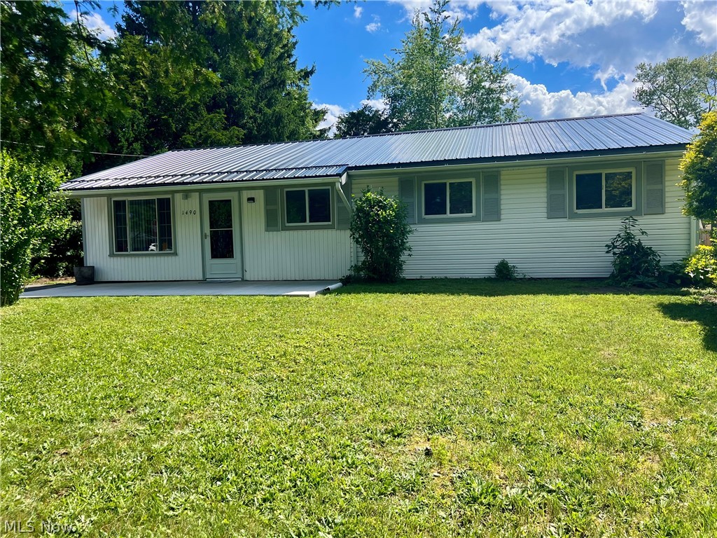 Welcome home to this well-maintained 4-bedroom, 1.5-bath ranch in Brimfield Township offering easy one-floor living! Conveniently located near major universities, shopping, expressways, parks, and the water reservoir, this home combines comfort and convenience. Recent updates include fresh paint, flooring, hot water tank, furnace, central air conditioning, concrete front patio, and metal roof. The spacious layout provides plenty of room for family and guests, while the included appliances make moving in a breeze. Outside, you'll find an 8x12 storage shed for additional storage and a nice yard to enjoy. Don't miss this move-in-ready opportunity in a desirable location!