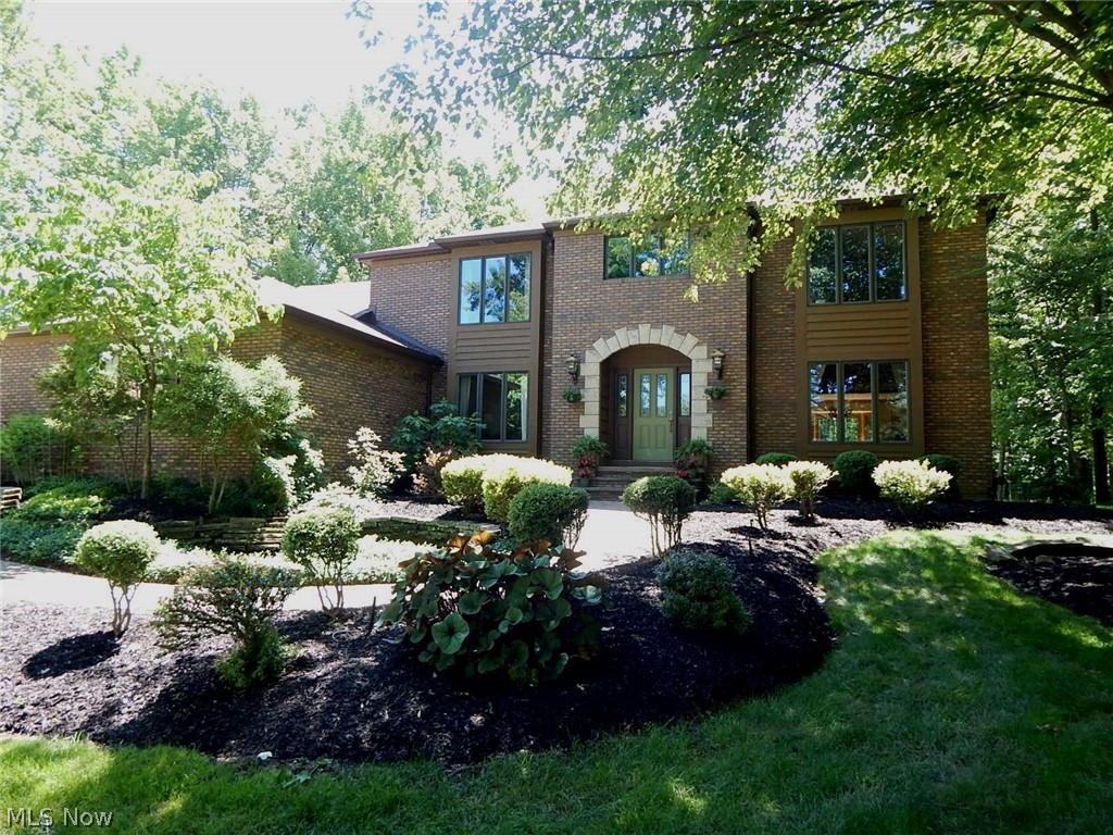 Welcome to this beautiful 4 bedroom home situated on a cul-de-sac in The Timbers of Brecksville! The welcoming foyer features a hardwood floor and circular staircase. Off the foyer are the living and dining rooms and an office, all with carpet and neutral décor. The large, eat-in kitchen offers ceramic tile, granite counters, some stainless appliances that will remain, and a bay window with wonderful views of nature. Open to the kitchen is the gorgeous vaulted family room with skylights, a raised-hearth gas fireplace, newer hardwood floor, built-in bar and back staircase leading to a loft. The stunning, vaulted sun room with three walls of glass, a gas heater and access to the patio may well become your favorite space! Also on the first floor are the laundry room and a bath. The master suite features a newer hardwood floor with a small space for an office or sitting room, a walk-in closet and a beautifully updated bath with ceramic tile, jetted tub and a skylight. The three additional