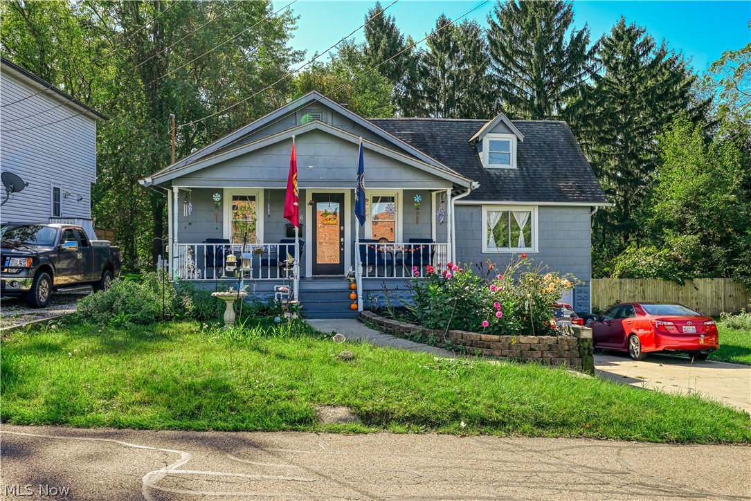 Welcome to this beautifully updated Cape Cod home in the Ellet area, situated right across from Windemere Elementary. It boasts attractive curb appeal and a welcoming front porch that leads into a living room adorned with new vinyl plank flooring, which is consistent throughout the property. The dining room is nestled between the living space and a beautifully renovated kitchen featuring a tiled backsplash, pristine white cabinets, and modern stainless steel appliances. Experience the ease of single-floor living with two bedrooms and two full bathrooms on the main level. The master bedroom offers a private bathroom with both a tub and a tiled shower, and the second bathroom is just as remarkable. The second floor offers 2 additional bedrooms, with one perfectly suited for a home office setup. Outside, enjoy the back deck overlooking a scenic wooded area, a spacious side yard, and a long driveway that leads to an integrated two-car garage. Recent updates include brand-new flooring, fresh paint, contemporary lighting, remodeled kitchen and bathrooms, a new water heater, and an updated electrical panel. This Home is move in ready and checks all the boxes for anyone looking for a great place to call Home! Closing will be contingent on the seller's new condo closing for a seemless transition.