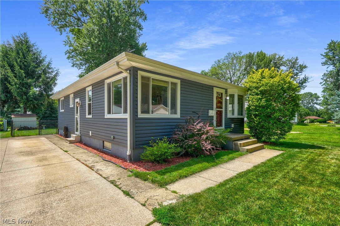 Opportunity awaits to become the next owner of this inviting 3-bedroom ranch in desirable Cuyahoga Falls. A light-filled living room welcomes you with hardwood floors and a beautiful bay window. The open kitchen provides ample cabinetry, generous counter space, breakfast bar, and stainless-steel appliances that remain. An updated full bath and three nicely sized bedrooms complete the main level.  The walk-out lower level offers a partially finished retreat.... perfect for hobbies, relaxation, or additional living space. You’ll also find a laundry area with washer and dryer included, a workbench, glass block windows, and abundant storage.  Outside, the fenced-in yard is ideal for entertaining with a patio, fire pit, and storage shed. Major improvements include a Carrier furnace and AC (2020 & 2022), newer siding, and a concrete driveway. A wonderful option for first-time buyers or those looking to downsize. Moments from dining, entertainment, and shopping. Contact the listing agent or your lending partner for details on the low-interest (3%) assumable FHA mortgage.  Make your appointment today!