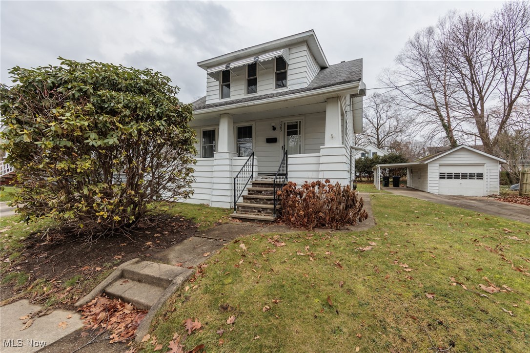 A wonderful Cuyahoga Falls Bungalow with an extra wide lot, including 2 parcels.  This home was built with some very cool architectural qualities.  A large living room has a lovely decorative gas log fireplace.  This home features a garage with an additional large/paved carport.  There are vinyl windows, a full/partially finished basement, a fully applianced kitchen, formal dining room, and so much more.