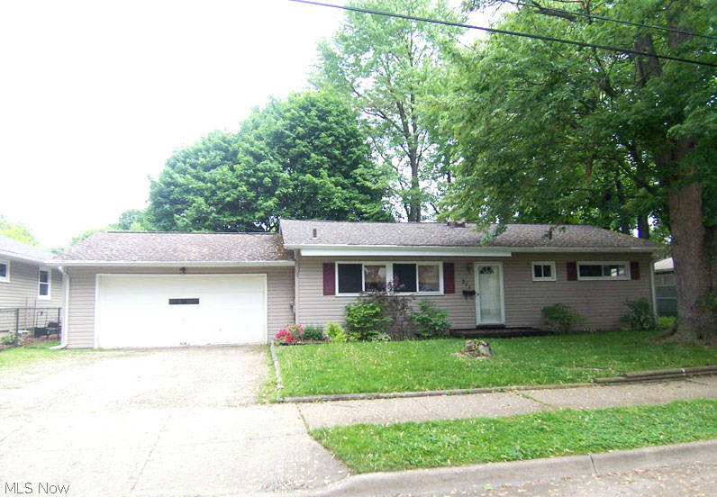 Wow! Contemporary Ranch on double lot.  What more could you ask for?  2 car attached garage, maintenance free vinyl siding, all bedrooms have replacement windows.  Kitchen completely updated with new stainless appliances, cabinets, Allure flooring & more. All carpet on first floor is new including Sun Room.  Sun Room has wood burning stove for "year around" heat.  Every room including basement has just been painted in fashion neutrals.  Huge basement is partially finished and has a convenient sink and commode.  Huge back yard is private and fenced with two gates.  Full bath completely updated with vanity surround and more!  Comes with a 1 year warranty from America's Preferred.  This isn't going to last! Hurry!
