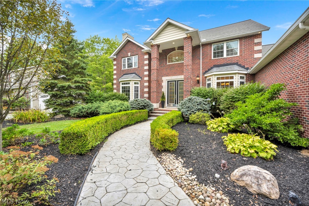Welcome to this stunning 4-bedroom, 3.5-bath home perfectly situated on a serene 1.3-acre lot. Designed with comfort and functionality in mind, the first floor offers a bedroom and full bath—ideal for guests or multigenerational living. The spacious eat-in kitchen is a true centerpiece, featuring an abundance of cabinets, expansive counter space, a beautiful breakfast bar, and a large island perfect for meal prep. From the kitchen, step out onto the patio to enjoy picturesque views of the private backyard and unwind in the hot tub, newly added in 2022. The open-concept layout seamlessly connects the kitchen to the massive great room, complete with a cozy fireplace, while the formal dining room provides the perfect setting for gatherings. A front office with its own fireplace and seating area offers a warm and inviting workspace. The oversized first-floor laundry room is both practical and stylish, boasting extensive cabinetry and counter space. Upstairs, the incredible primary suite is a retreat in itself, featuring a fireplace, spa-like bath with a massive shower, and a spacious walk-in closet. Two additional large bedrooms complete the upper level. The expansive basement, already plumbed for a full bath and wet bar, also includes stairs leading directly to the garage. With wide 36" doors throughout, thoughtful design, and modern updates, this home is completely move-in ready—waiting for you to make it your own.