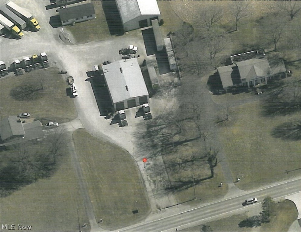 3800 Sq Ft building with four 14' doors on 1.38 +/- acres for $3000 per month NNN lease. Available immediately. Building is heated with fuel oil furnace. Well and septic. Owner will also lease manufactured home (great for office) with 6 offices, a reception area and bath behind building for an additional $600 per month. Additional truck parking area (approximately 1.8 acres) available on a solid gravel lot for $1,200 per month. Lease it all (approximately 3.8 acres) for $4,800.  Ideal for a truck servicing facility.