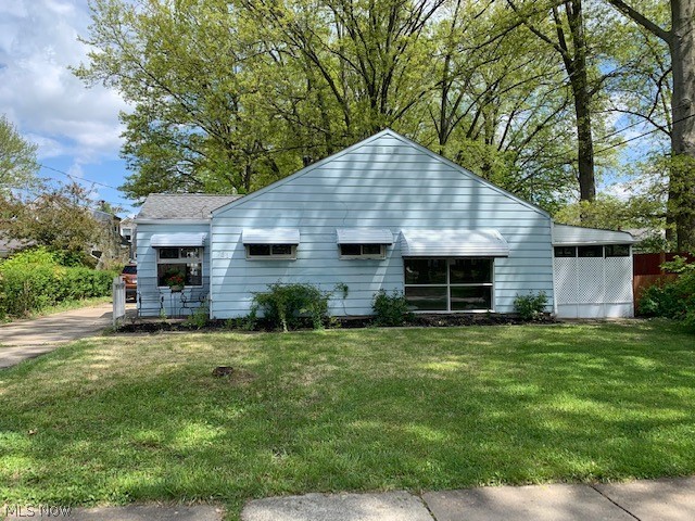 Spacious first floor living! Come enjoy this recently power washed,  3 bedroom home complete with a large fenced in private back yard and enclosed patio room!  This adorable home has a cute breakfast nook next to a bright window off the kitchen, a mammoth living room, a first floor laundry, and 3 nicely sized bedrooms!  The bathroom was remodeled recently and is ready for someone to come make the next rounds of updates.  Enjoy some coffee in the morning or watch some TV in the evenings in the screened in patio room!  The yard is completely fenced in for your fur baby safety!  A spacious detached garage is one extra perk for this home.  Did I mention that a wonderful bonus is that this house is across from Lions Park? This price is just right for a first time home buyer, or someone ready to downsize!  Come visit it today!!