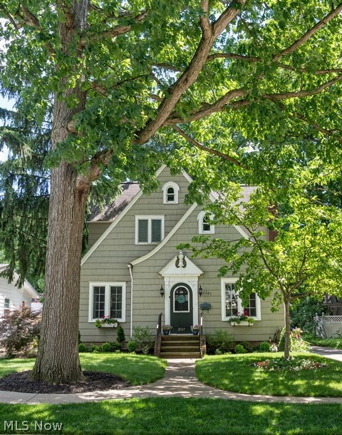 A real beauty.   This charming chalet colonial is a must see.  The seller has lovingly done extensive work with all hardwood floors, freshly painted, new windows in most of the house including storm/screen combos for living room, dining room and office.  There are new ceiling fans and light fixtures.  There is crown molding in the living room and dining room that adds character.  All appliances stay.  In the master bedroom there is a large wood paneled walk-in closet updated with bead board interior walls and wired lighting. In the second bedroom there is also a walk in closet.  The decorative trim around fireplace has a hidden cord.  
The basement is divided into several rooms and has been waterproofed with a transferrable life time warranty.  There is laminate flooring and baseboards in most of the basement. There is a craft room, a photography studio, work room and storage.  Must see to appreciate.  The flagstone patio was reinstalled and expanded, along with a brick walkway to the