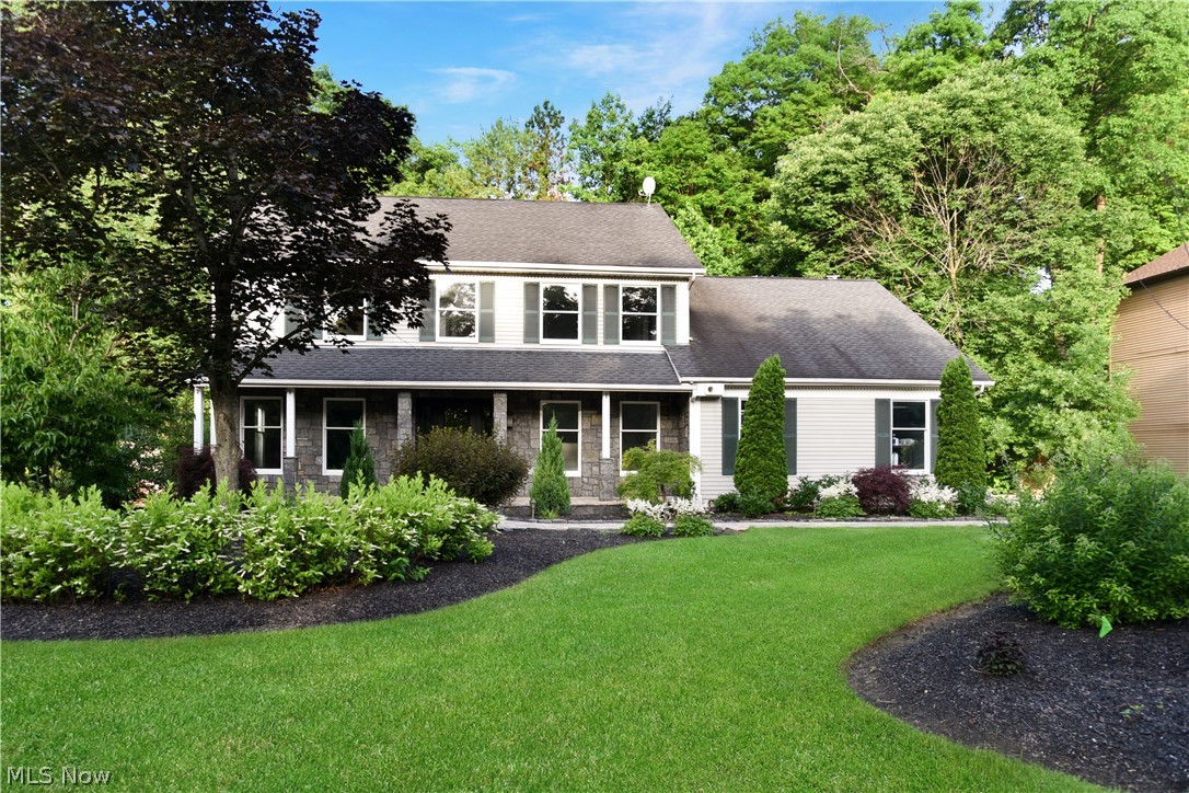 Stunning, remodeled, beautiful front porch colonial. Pride of ownership. Newer pavers and stone front. Newly remodeled bathrooms, carpeting first and second floor, and freshly painted. Formal living room and dining room with trim of wood floor all around; you can have carpeting or area rug in the center. First floor office/den. Spectacular kitchen custom cabinets, granite counter, newr build-in oven,  Sub-Zero refrigerator all appliances stay, pantry  Fabulous family room with cathedral ceilings, custom fireplace. Second floor has 4 bedrooms, large laundry room, 2 bedrooms with laminate wood floors, 2 with newer carpeting. Luxurious owner's suite, walk-in closet, 21x9 gorgeous newly remodeled glamour bath, tile shower. Newly remodeled main bath. Second floor storage area. Finished walk-out basement. Great room, half bath, woodshop, and storage area. Newer professional landscaping, heated driveway and walkway, Newer driveway,  walkway, garage door, front door.  Great value. Do not miss