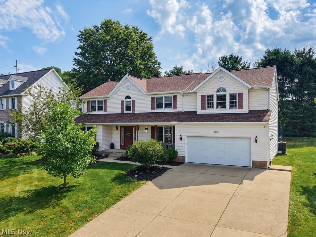 Welcome to this beautifully maintained Colonial offering exceptional space, incredible versatility, and lots of room to grow.  Nestled in one of Wadsworth's sought-after north-end neighborhoods, this rare property offers 6 bedrooms, 3 full baths, and the perfect blend of comfort and style. A welcoming front porch leads to a dramatic two-story foyer with soaring ceilings, hardwood floors, and an elegant staircase.  The spacious living and family rooms flow seamlessly into the eat-in kitchen featuring solid wood cabinetry, center island, newer stainless steel appliances, and a bright dining area overlooking the backyard. Sliding doors open to a large deck, fire pit, and expansive green space, perfect for summer cookouts, backyard games, and entertaining.  The main level also features a formal dining room, first-floor laundry with utility sink, plus a bedroom and full bath, ideal for guests, a home office, or multi-generational living.  Upstairs you'll find five spacious bedrooms with large or walk-in closets, including one plumbed for second-floor laundry. The oversized guest bath offers double vanities and a tub/shower combination. The show-stopping owner's retreat spans approximately 600 square feet and includes an adjoining office, nursery, or sitting room, his-and-hers closets, and a beautifully renovated ensuite bath with heated tile floors, dual granite vanities, a two-person jetted tub, oversized walk-in tile shower, and direct-vent gas fireplace. A dedicated A/C unit keeps the suite comfortable year-round. Finished lower level is built for fun with home theater, projection screen, built-in bar, bonus room for a home gym, playroom, craft room, or possible 7th bedroom, plus abundant storage. Complete with a two-car attached garage, oversized driveway, and an unbeatable location near schools, parks, shopping, restaurants, highways, and the vibrant Main Street Wadsworth downtown area, this timeless home is ready for your next chapter. Welcome to home sweet home!