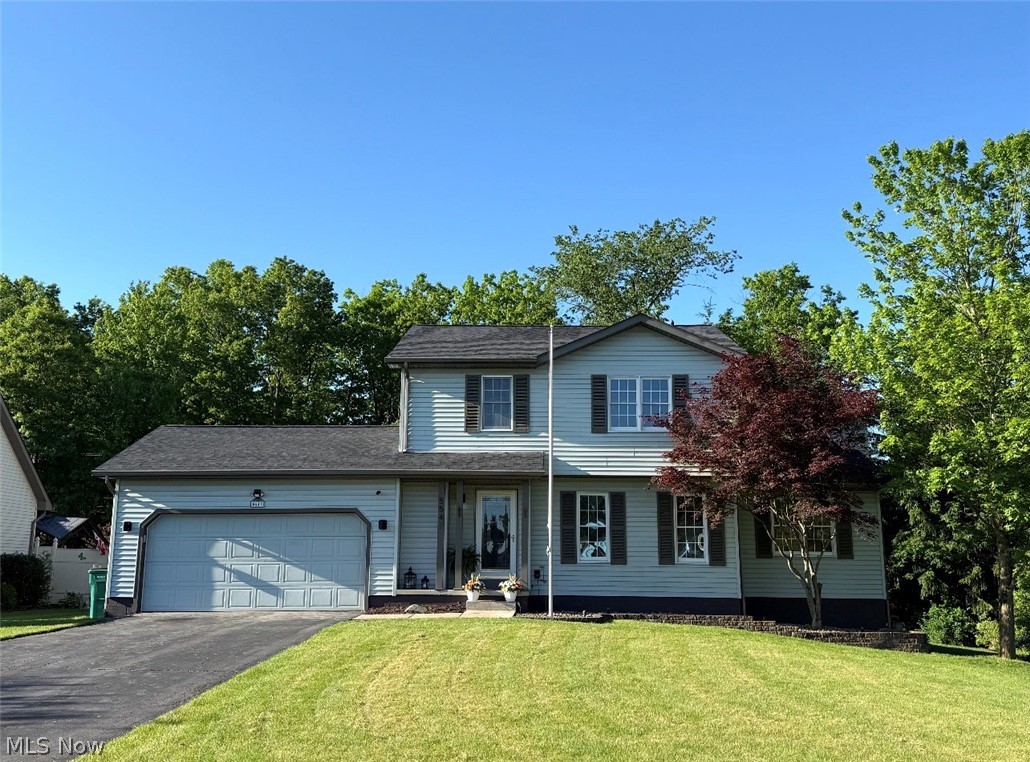 What a Beautiful place to call home in The Lovely Cider Mill Crossing Neighborhood! This Stunning Home is picture perfect and ready to move in! Two-story Colonial nestled on a semi-private lot has 3 Bedrooms and 2 1/2 bathrooms. First Floor includes lovely Living Room with gorgeous dark wood-like flooring and lots of natural lighting. The Family Room includes  a fabulous remote controlled Fireplace with decorative lighting as well as the lovely dark wood-like flooring. Extra Large Kitchen with ALL STAINLESS STEEL APPLIANCES and plenty of storage in the all oak cabinets. Kitchen also opens into a large dining area. Enjoy your days and nights on the AWESOME EXTRA-LARGE NEWLY FINISHED DECK. The Primary Suite includes large walk-in closet and FABULOUS SPA-LIKE REMODELED BATHROOM. 2 other Bedrooms and another REMODELED BATH complete the 2nd floor. Basement is as neat as a pin with freshly painted floors. This home complete with an attached 2 car garage and a HOME WARRANTY!!! Newer Roof (2.5 yrs old) The HVAC, Furnace, and Hot water tank were new in 2021.