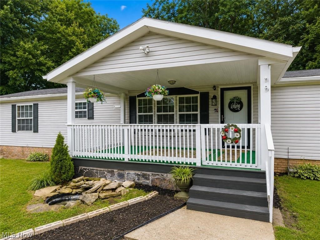 Welcome home to this fully remodeled 3-bedroom, 2-bath ranch which features fresh paint, all new carpeting, and a brand new roof! Situated on a .78-acre lot in Coventry Township, with over 1,600 square feet of single-floor living, this home has an open-concept layout that's perfect for both everyday living and entertaining. The spacious living area flows into a large kitchen with plenty of cabinets and a dining room, creating an inviting atmosphere filled with natural light. The master bedroom has an ensuite full bathroom with gorgeous double doors leading to a relaxing jacuzzi tub. Two additional bedrooms and another full bath provide plenty of room for family, guests, or a home office. Outside, you'll appreciate the expansive yard with plenty of space to relax, garden, or entertain. A large storage shed provides extra room for tools and outdoor equipment, while the attached carport offers covered parking. Conveniently located just minutes from Portage Lakes, shopping, restaurants, and everyday amenities, you'll enjoy the perfect balance of peaceful living and easy access to everything you need. Whether you're looking for your first home, downsizing, or simply searching for low-maintenance, one-floor living, this move-in ready property is one you won't want to miss. Schedule your private showing today!