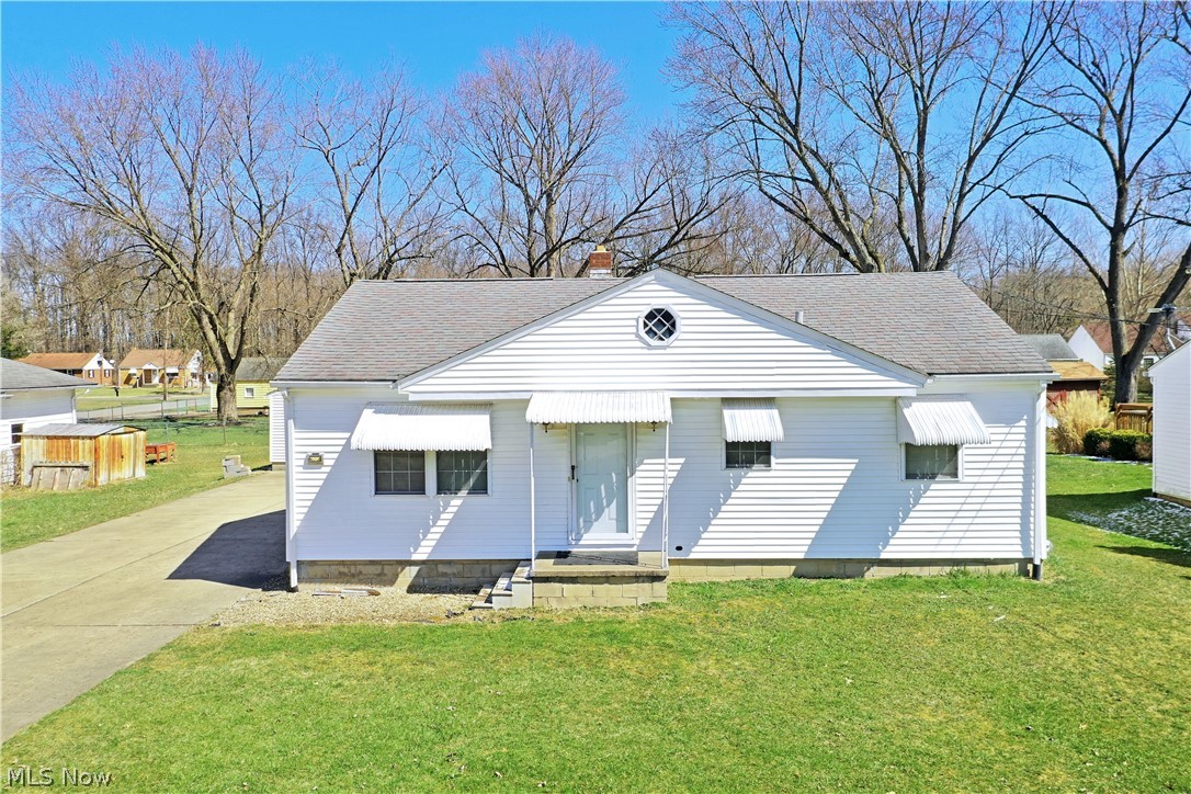 Don’t miss this move-in-ready Champion Township, three-bedroom ranch, offering a full basement and unique handicap-accessible features! This surprisingly spacious makes an advantageous home for any potential buyer with its clean kept and bright living space that includes a lovely rear 4 seasons room and a huge rear deck. Multiple awnings line the front of the home, keeping hard light out while offering inviting natural lighting through the hardwood filled living room. Matching wood trim work follows throughout, as the front hall leads past an oversized full bath with floor entry shower, wrapping handrail, and a collapsible chair. A pair of nicely sized bedrooms with great closet space branch away nearby. Opposite the living room, a substantial eat-in kitchen brings a multitude of cabinetry paired with piano black appliances. Room for casual dining is located beneath a large window. A central dining room offsets both the finished 4 seasons room and the larger, master bedroom with new vi