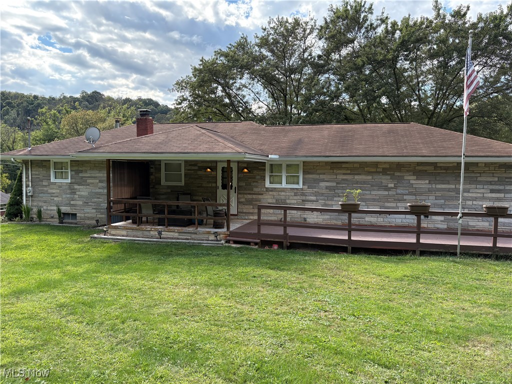 SURROUND YOURSELF IN TRANQUILITY in this inviting 3 bedroom, 2 bath ranch home nestled on 5.5 peaceful acres encircled by idyllic nature and majestic woods. This well-maintained home provides one-level living full of comfort and functionality. Relax with a cup of coffee on the covered front porch while enjoying the serenity of the picturesque neighborhood in Colliers. All 3 bedrooms located on the main level boast original beautiful hard wood flooring and the Livingroom is highlighted with its handsome built in shelving. Keep cool these last few summer-like days in the comfort of the air conditioning or curl up by the glow of the fireplace as you sip a beverage from the cozy bar downstairs adjacent to the sizeable rec room. The 2 car garage and barn offer plenty of storage for tools, lawn equipment, seasonal items, and more. This Amazing property includes 5.5 acres and a Home Warranty! It won't last long! Call today to schedule your private viewing.

TERMS: Sale subject to owner's confirmation. NON-REFUNDABLE deposit on accepted offer or winning bidder on auction day. Bidder must be present with a letter of pre-approval at or before registration. No contingencies in contract. Properties sold "as is" It is the purchaser's responsibility to perform all inspections prior to bidding. A buyer's premium will be added to the final bid to establish contract price. All terms and conditions and other announcements made day of auction are binding and take precedence over any information here in.