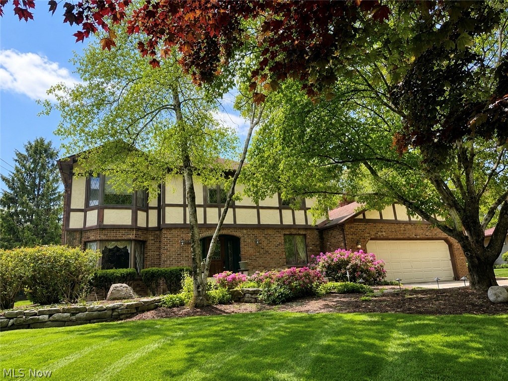 Back on the market with fresh updates including new carpet and paint throughout! Move right in! Proudly presenting this extraordinary custom-built residence-meticulously crafted over seven years and impeccably maintained by its original owner. A rare opportunity to own a home with such enduring quality, ideally situated on private, wooded grounds within the highly acclaimed Canfield Local School District.
A grand foyer welcomes you with elegant leaded-glass sidelights, rich solid oak doors and trim, graceful arched openings, and a striking custom spiral staircase-an immediate statement of the artistry poured into every detail.
The main level showcases an expansive great room anchored by a beautiful fireplace, a fully appointed kitchen with custom cabinetry, and a charming breakfast nook with sliding glass doors opening to the rear porch. A formal dining room sets the stage for memorable gatherings, while the distinguished library-complete with bespoke built-ins and a sunlit bay window-offers an inviting retreat for work or relaxation. The Florida room provides sweeping views of the serene, wooded backdrop and is beautifully framed by a brand-new wrought iron fence, with additional garden space extending beyond the fenced grounds.
Upstairs, three large bedrooms provide exceptional versatility. The front bedroom features a bay window, while a secondary bedroom includes both an in-room closet and a full walk-in closet. The luxurious primary suite is highlighted by a spa-inspired bath with jacuzzi tub and a custom-designed walk-in closet.
Automotive enthusiasts and hobbyists will appreciate the heated attached garage with direct basement access, dedicated workshop nook, and an additional storage shed.
Thoughtful amenities continue throughout the home, including a full-size laundry room with convenient laundry chutes, whole-house water softener, security system, Pella windows, custom hardware, and a sprawling lower level ready to be finished.