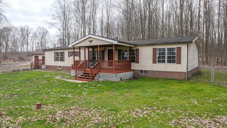Here is a nice almost 5 acre property with a 3 bedroom/2 bath home with several outbuildings in a beautiful country setting. The options are many with oversized 2 car garage with electric, a newer 24' x 30' barn/workshop with 220 amp electric, propane & wood-burner heat. There are also a 12' x 16'and a 12' x 40' buildings. This nice home has hardwood flooring in the living room, kitchen, dining room, and there is a gas fireplace in the living room, and a wood stove in the adjoining room. The home  features a nice front porch for you to relax with your morning coffee. There is also a nice deck for you to enjoy. The nice big front lawn has chain link fence for your pets or kids to roam, and exercise in. Behind the house is a nice back yard going to the wooded area in the back. Some of the timber was harvested last year, which leaves you with plenty of firewood for your enjoyment or to sell as camp firewood.  Come take a look, and make your move on this move in ready home before it's gone.