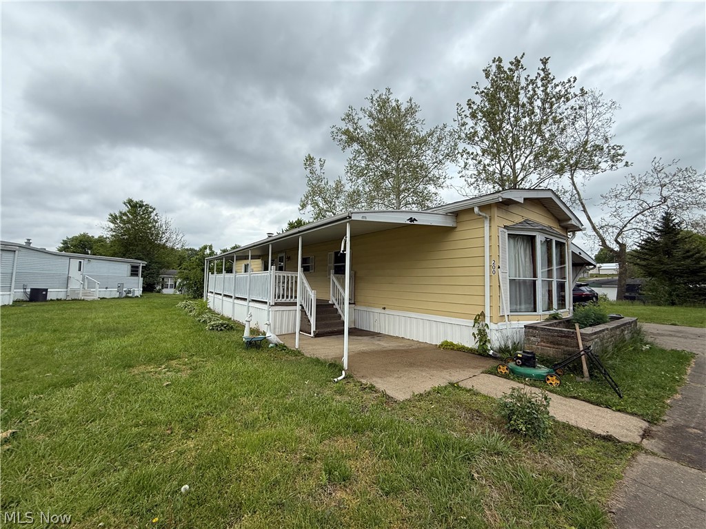 Affordable living awaits at 200 Driftwood Drive! This 14 x 68 Kingsley manufactured home features a spacious kitchen, large living room, 2 bedrooms, and 2 full bathrooms. Highlights include a laundry room, front yard, and a backyard area. While several updates have already been completed, a few final touches will make this property the perfect home. Situated in the all-ages Shel Mar Estates  Community, featuring paved streets and a monthly lot rent that covers trash, water, and sewer services.