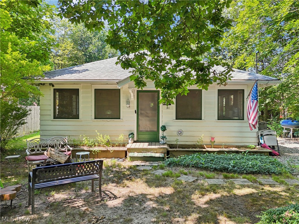 The address is 105 Hartzell Rd. It used to be Cottage #51 Hartzell Rd. This property is NOT part of the Berlin Lake Golf & Swim Club and that is located directly across the street. You do not have an HOA and you are not mandated to join as a member. It is optional. They have a golf membership and the social membership costs less. The social membership includes swimming with heated pool. With an acceptable offer, the seller will sponsor the buyer as a member and pay for a one year membership. Lake inlet is behind the cottage. No dock.