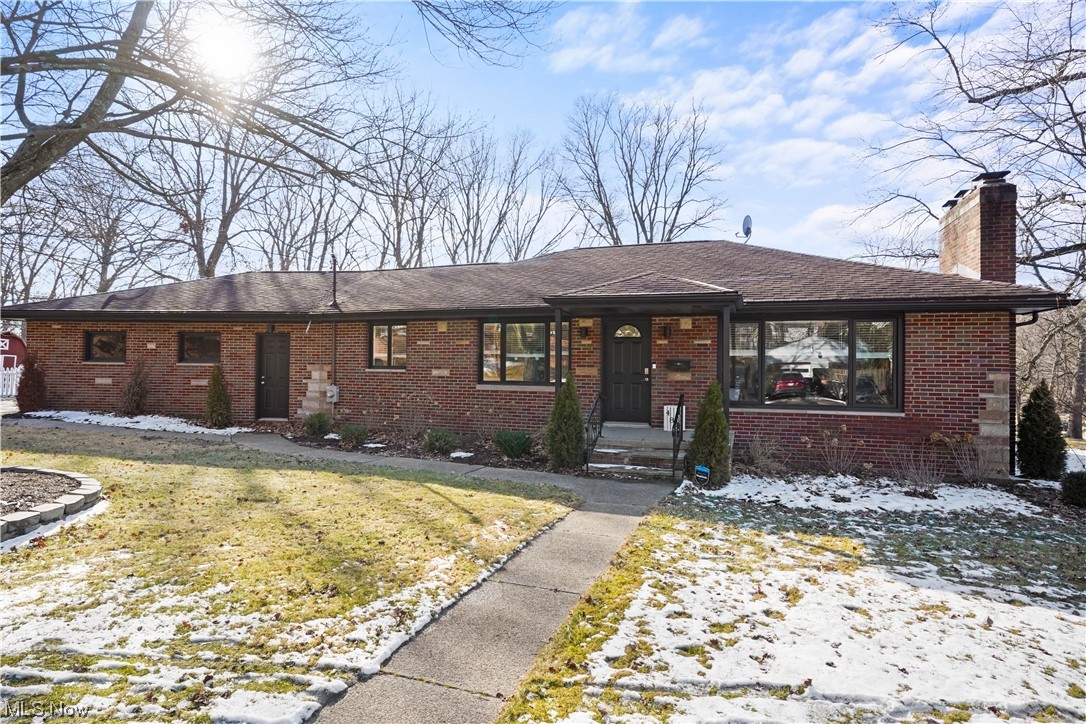 Beautiful Brick Ranch on 1/2 acre in a lovely well maintained Akron neighborhood. The floor plan is open and light and bright. The first floor has been updated with  Luxury Vinyl floors and new light fixtures throughout. The living room has a large bay window and white wood burning fireplace accentuated with shiplap. The impressive kitchen has  attractive cabinets with some open shelving, a stainlees steel farmhouse sink and a large pantry with sliding barn door. There are three generous sized bedrooms and a beautifully updated full bath.  The lower level has a 42 x 14 nicely finished rec room with a second fireplace, a laundry room and a utility room.
Outside you'll find a circle driveway a 2 car attached garage and large fenced area plus a shed.