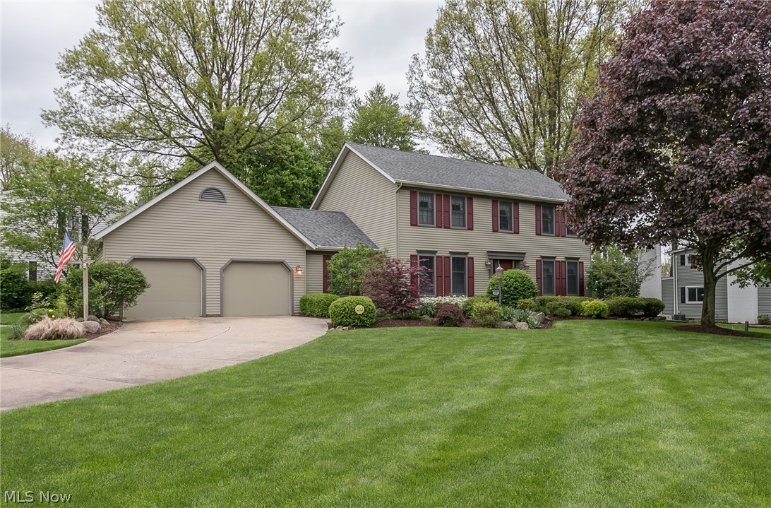 This Beautiful 4 Bed, 3.5 Bath custom-built Colonial (1988 by Wise Brothers) made-to-fit 2 corner lots in the desirable W. Twin Lakes (Kent, OH) area. The impressive architectural design w/ unmatched curb appeal boasts gorgeous landscaping and manicured lawn! Great location just 8-10 minutes fr. OH PIKE. Lake privileges & use of private Twin Lakes beach. Meticulously-cared-for by the only owners, you're greeted w/ all the extra touches that speak "quality": wide trim, crown moldings, dedicated office, granite kitchen, huge paver stone patio, extra-long front windows, central vac system, irrigation system & landscape lighting... & MORE! Great lower level Rec Room w/ bar & Full BA adds about 687 sq. ft. of living & entertainment space! Great home office on first floor with beautiful custom built-in desk & filing/storage is perfect for a work-from-home situation.  Awesome vaulted Master Bedroom. Wood burning fireplace for those cozy nights at home in the family room. Wonderful basement st