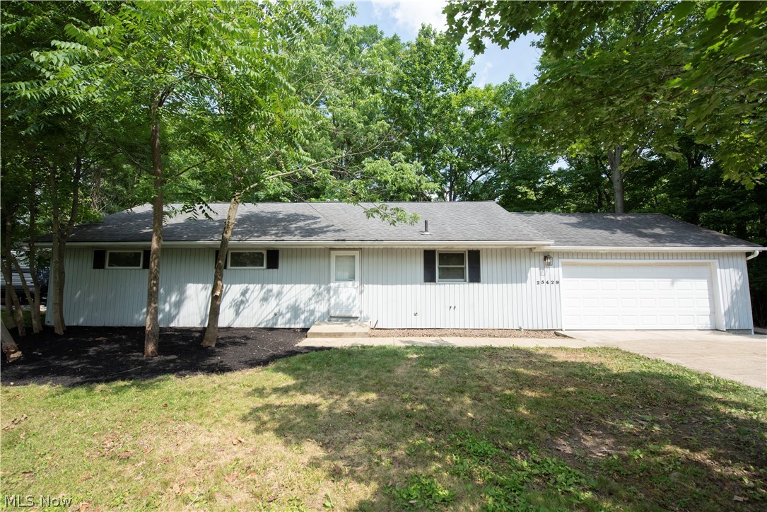 Welcome home to this beautifully updated ranch nestled on a scenic wooded lot overlooking the Rocky River! Offering over 2,100 square feet of finished living space, this move-in-ready home combines modern finishes with peaceful natural surroundings.

Inside, you'll find 3 spacious bedrooms and 2½ bathrooms, along with a thoughtfully updated kitchen featuring new stainless steel appliances, quartz countertops, soft-close custom cabinetry and a timeless tile backsplash. The open and inviting layout is perfect for both everyday living and entertaining.

The finished walk-out basement expands the living space with a built-in wet bar, creating the ideal setting for game days, gatherings, or a relaxing evening at home. Step outside to enjoy two incredible outdoor living areas: a screened-in deck off the primary bedroom and a lower deck accessible from the walk-out basement, both offering tranquil views of the wooded landscape and the Rocky River.

Located in the heart of Olmsted Falls, you'll enjoy the charm of a picturesque small town with excellent local restaurants, parks, and community events, while still benefiting from convenient access to Cleveland Hopkins International Airport and being just 30 minutes from Downtown Cleveland.

If you're looking for turnkey living, beautiful views, and an unbeatable location, this exceptional ranch is one you won't want to miss.