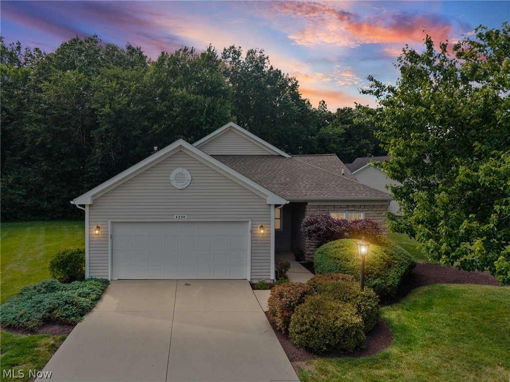 Looking for a tasteful ranch in a delightful neighborhood where the drudgery of endless yardwork and snow removal are burdens of the past, while not restricted to a "postage stamp" sized lot? Welcome to Avon's Reserve at Summer Hill, whose winding roads and golf course- like topography lead to this attractively priced 2BR+Den Cluster on an oversized .54 acre lot! This 1600+ square foot ranch – sans stairs and tastefully clad in a clean, neutral color palette -“lives large” with its soaring ceilings, open floor plan & abundance of replacement windows that invite the lush and well manicured landscape indoors. Sparkling clean, this space is move-in-ready and features a true primary suite, vaulted, w/ walk-in closet & private bath, bedroom 2 as well as a study. Generous closets, kitchen pantry & laundry room readily offsets the absence of a basement. Eat-in kitchen features an abundance of wood cabinetry, double sink with a window view, and all appliances (gas cooking) & flows into the main Great Rm as well as a Dining Room area! White wide-slatted blinds, in excellent condition, convey. The sizeable laundry room with utility sink is perfectly located off the garage entry, and the manicured lot – professionally maintained by the HOA – lends privacy and presence to this outstanding cluster home, priced below recent sales.  Recently installed (Spring '26) sliders off the great room lead to a concrete patio & a serene view of nature in all its majesty with no rear neighbors with the exception of mature trees which form the rear border of this picturesque lot. Included in the $220.monthly HOA fee is snow removal, maintenance of the well-sculpted common areas, as well as annual pruning of each owner’s landscape. This community is well managed by Lawrence Management, located right in Avon. 1-Year America's Preferred Home Warranty for added peace of mind. Immediate occupancy is available…come see and relish how comfortable “right-sizing” looks, feels and costs!