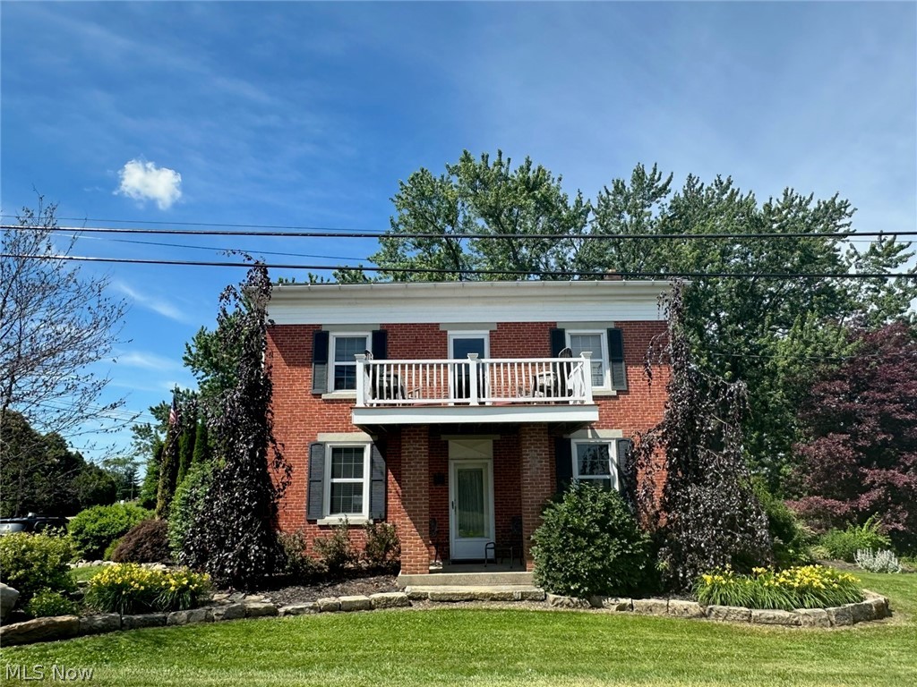 Welcome to 8385 Paris Ave. A two story brick colonial with a beautiful setting and unique features throughout the home.  As you enter the side entrance there is a two tiered patio off the kitchen. The upper patio is stamped concrete and is hot tub ready with electric.  The lower patio is brick and pavers with surrounding sandstone.  You will enter the large kitchen/dining area off the patio through the custom stained glass door.  The kitchen features a slate floor, custom ,walnut cabinets, custom granite counter tops, an island bar, facade back splash, a hickory sliding barn door, a 6 ft gas vented fireplace and a 7ft pantry. As you leave the kitchen through the sliding door there  is a  living room, billiard room (the pool table stays), full bath/laundry, and a den to complete the first floor. The second floor features 3 bedrooms and full bath with walk-in-shower. All the bedrooms have black walnut flooring.  Two of the bedrooms have large double closets  The master bedroom has a door leading to a 2nd story 7 ft  x 10 ft porch, that you can sit and enjoy the evenings. The outside grounds feels like your own private resort.  The backyard host a variety of trees and flower beds. There is a 24 x 17 ft  concrete patio with a brick cobblestone wall winding its way to an 18 x 33 ft above ground heated pool with Azerk decking and shipyard roping. There is a two car detached garage with a loft and a newer metal roof.  You have to see this home to appreciate its value. Make your appt today.