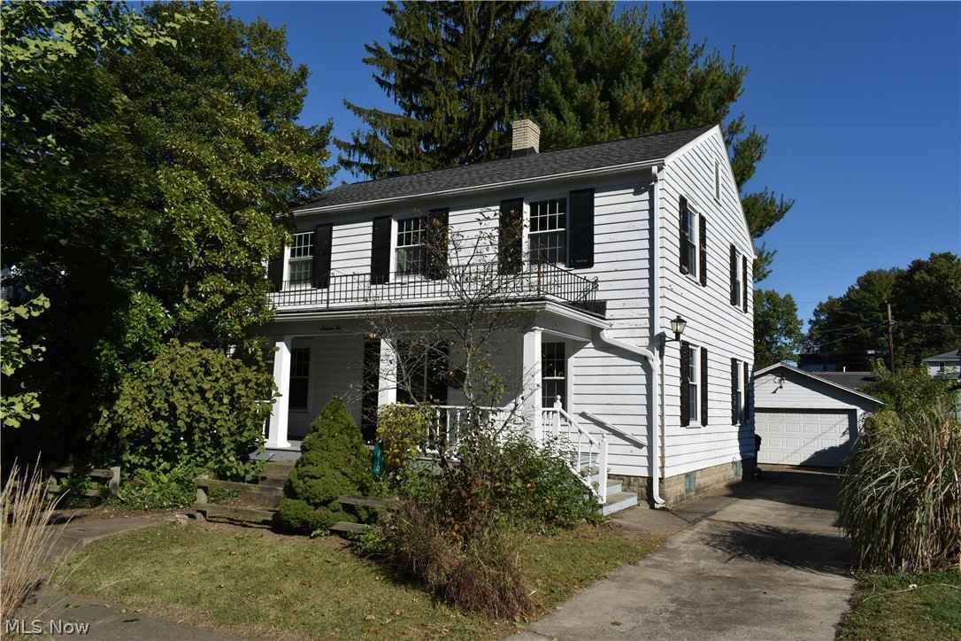 Classic Colonial Home with 4 bedrooms and 2 bathrooms located on a lot with many mature trees.  All rooms have original wood floors, except the kitchen has ceramic tile.  The full basement has a partially finished family room with decorative fire place.  There also is a utility room and 2 small additional rooms perfect for storage or food cellar.  The main level has an eat-in kitchen with mud room with skylight and a dining room, large living room, and a half bathroom.  The 2nd level has 4 bedrooms and a full bathroom, and a door in one of the bedrooms has steps to access an unfinished attic .  The front of the home has a covered porch.  The back yard has a small patio area and a fenced in yard with many plants and mature trees.  There is a nice sized 2 car detached garage.  Call today to schedule a private showing of this home.