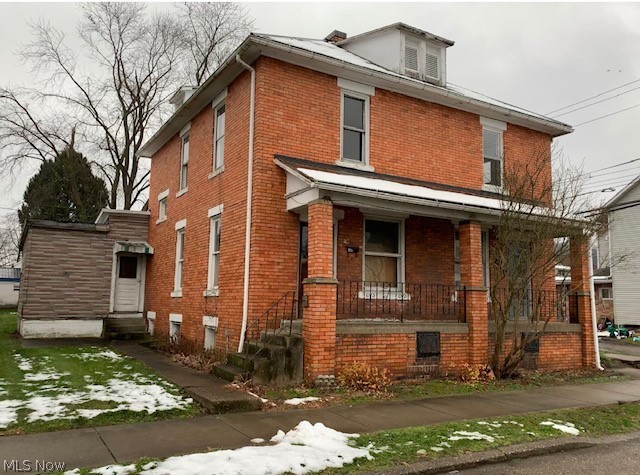 Side by side 2 story brick duplex with 2 additions to original building.  Unit on right could be move in ready, however, left unit's kitchen requires attention. Remodeled bath 1st floor of unit on right. 100 AMP each unit.