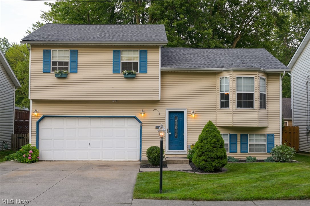 This exceptionally maintained home boasts a open concept living area with cathedral ceiling in the living room, dining room & kitchen. Directly off the dining room is a large sun room that leads to a multi-tiered deck and patio with fire pit. You will enjoy the beautiful fenced in back yard.  The huge lower level family room is complimented by a stone fireplace and has direct access to the back yard as well.  Welcome Home.
