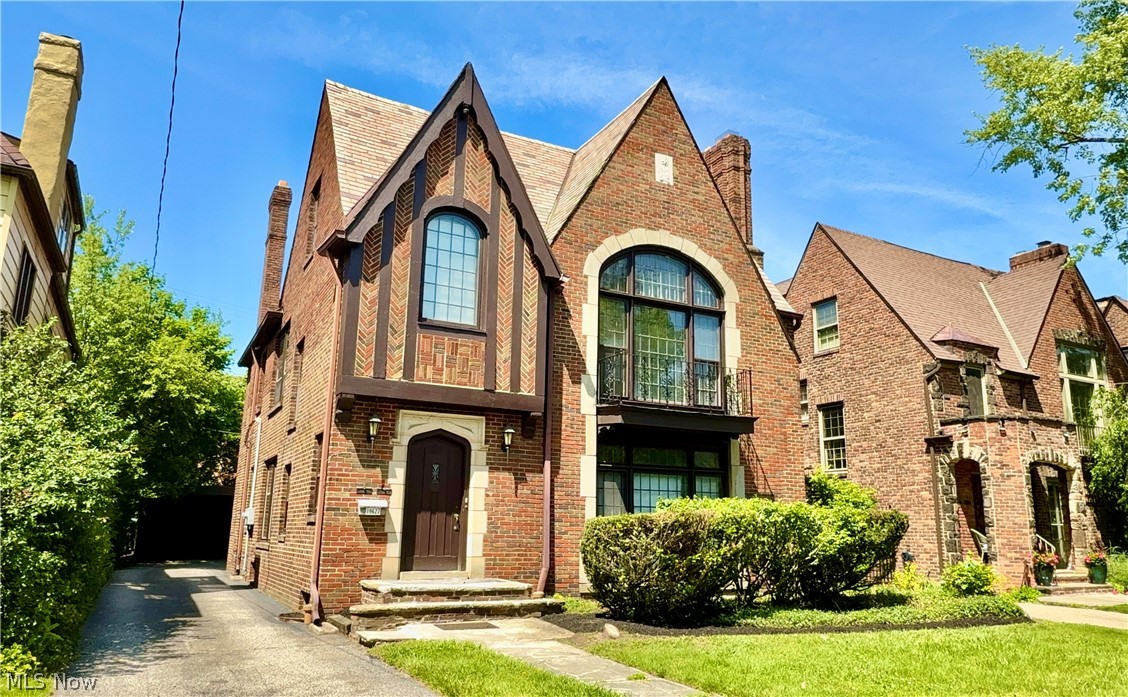 Location! Location! Location! Historic Winslow district. Majestic Shaker Heights one of a kind two family brick Tudor
features leaded glass windows, vaulted ceilings, beautiful moldings, hardwood floors throughout. Gorgeous 5 bedroom
upstairs unit with two story living room perfect for owner occupant or luxury rental featuring brand new upscale kitchen. Up unit is currently tenant occupied.  Built-in corner cabinets with leaded glass doors in formal dining room. Beautiful 2 bedroom first floor unit currently vacant and available to show. Walking distance to Van Aken shopping district, RTA line to downtown. Both units feature updated forced air heating and central air. 3 car garage. Total of 7 bedrooms and 4 baths! Shaker Heights point of sale compliant.
