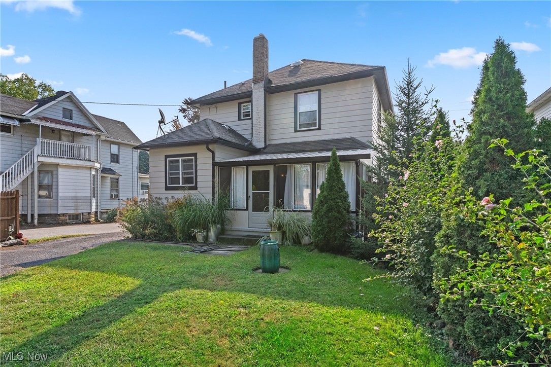 Welcome to this adorable 3-bedroom Colonial just minutes from downtown Painesville! Step inside to a cozy, welcoming foyer that opens to a comfortable living room—perfect for relaxing or gathering with family and friends by the warm fireplace. The dining room offers generous space for hosting holiday dinners and special occasions and provides access to the inviting three-season room, an ideal spot to unwind with a good book or enjoy a peaceful retreat. The kitchen, located at the back of the home, features ample cabinetry and a functional layout designed for easy meal preparation. The main floor also includes a convenient laundry room and half bath for guests. The basement offers plenty of storage space and features a brand-new radon mitigation system and two new windows (2025). Upstairs, you’ll find three generously sized bedrooms and a full bath with updated plumbing (2024), including a primary bedroom with a cedar-lined closet. Attic access is located in the front bedroom, where you’ll discover two new windows (2025) and excellent potential for storage or future finishing into additional living space. Original hardwood floors run throughout much of the home, adding timeless character. Outside, enjoy a true garden oasis filled with color in the warmer months, a charming patio with fire pit, and a fenced-in area behind the garage. The one-car garage offers great storage and includes a unique historic coachman’s room—perfect for additional storage or a creative space. The exterior was fully repainted in 2024, giving the home a fresh, updated look. This charming gem is close to all Painesville amenities—schedule your showing today!