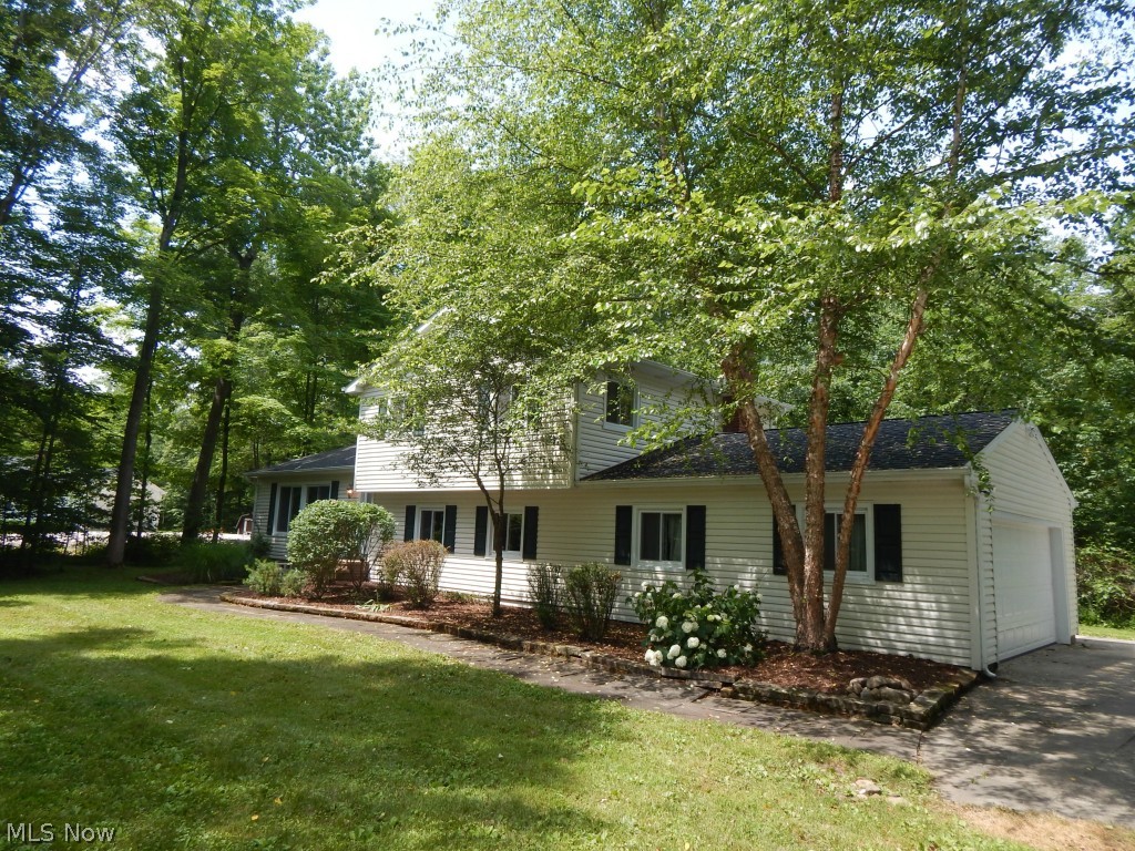 Space and Sunshine for the nature lover in you! Beautiful private 1.6 Acre lot on Cul-de-sac featuring spacious 3 or 4 Bedroom 4 level split. 
Your sure to be pleased with the total updated interior featuring new hickory kitchen, freshly painted interior and exceptional four season addition 
overlooking rear back yard. Newer baths, freshly painted interior, all new floor coverings  throughout.   
Near parks and schools. Don't miss the comfort of this energy efficient home with public sewer and well water. 
A true private rear yard with space for the growing family.