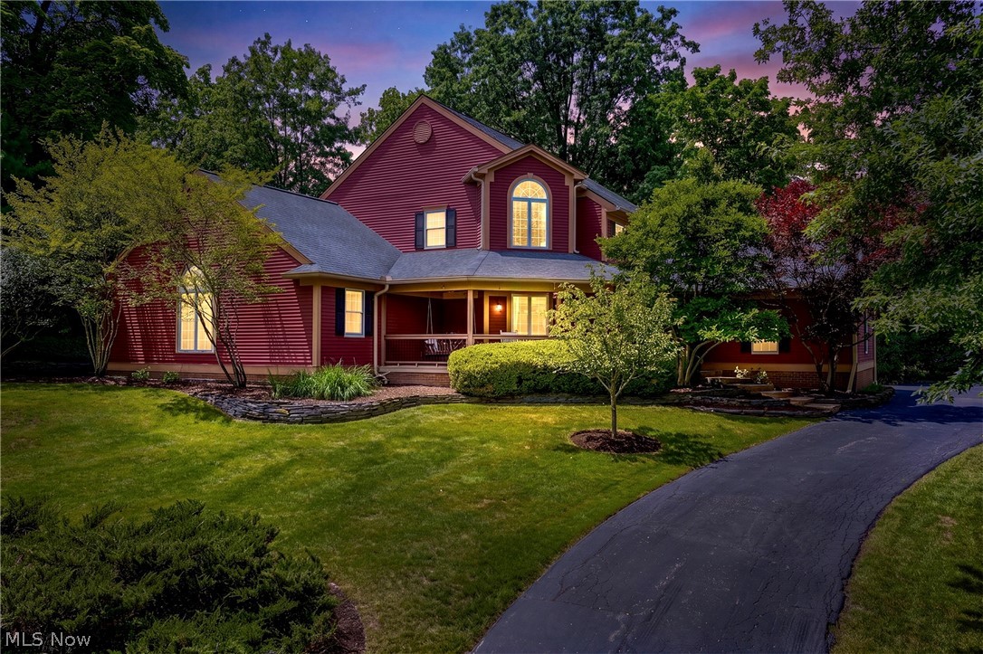 Some homes exist in a class of their own-this one was reimagined at its heart, w/every space impeccably appointed. This Grand Cape Cod offers 4 BR/4.5 BA w/4,852 sq ft of living space, wrapped in privacy & timeless elegance. A gently curving driveway winds to a whimsical covered porch. The backyard is a private, treed retreat, beautifully landscaped stone retaining walls, extended brick paver patio & an extended deck, creating multiple spots to unwind, entertain, or simply savor the quiet. Inside, solid wd flrs have been refinished & extended across the 1st flr, setting an elegant tone from the moment you enter. A beautifully appointed home office/den w/FP & cust built-in bookshelves is a refined retreat. Beyond a stunning great rm unfolds w/soaring ceilings, a wall of windows & a stately stone FP, flooding the space in nat light. At the heart of it all lies a masterfully redesigned kitchen, cust Amish crafted wd stained island, seaworthy toned cabinetry & gleaming Sea Pearl quartzite ctrs, illuminated by striking sunburst pendant lights. The space flows effortlessly into a DR reimagined beneath nat barn wd beams. Tucked within the kitchen, discover a hidden butler's pantry w/marble mosaic flr, cust shelving & a beverage bar a secret worth finding, a reimagined mudrm w/built-in cubbies & a laundry w/stackable washer/dryer. The 1st flr primary suite is truly a showstopper sprawling, w/soaring beamed ceilings, a generous seating area, walk-in closet & a spa-like ensuite. Ascend to a sun-filled landing that leads to a spacious guest/in-law suite w/private bath, 2 more generous BRs & a full bath. The lower level offers a cust wet bar, full bath, gym  & a spacious entertainment area, +flex space w/potential for a 5th BR. An entertainer's dream. All this within walking distance of Chagrin Falls' storybook downtown, where a cascading waterfall, charming boutiques & top-rated schools recently earned the village the title of Cleveland's Best Place to Live for 2025.