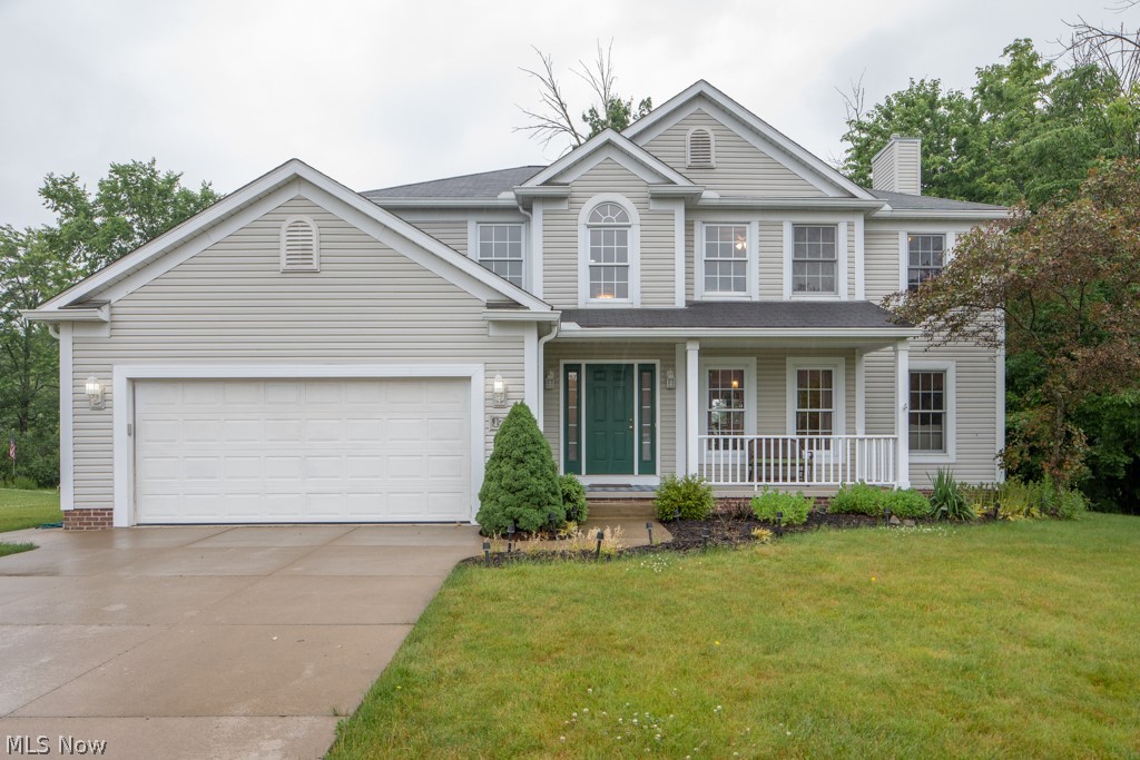 A wonderful Streetsboro colonial in the prestigious Hannum Xing, this 4 bedroom 2.5 bath colonial sits on over a 1/2 acre private lot.  With over 2300 sq ft, plus the basement is partially finished with painted walls and carpet, this spacious home has plenty of room to grow.  The large great room features a fireplace, and opens to the private office.  A large eat-in kitchen has an island, natural wood floors, and beautiful stainless steel appliances.  An exquisite 2 story foyer has the same natural wood floors.  There is also formal dining.  Each of the bedrooms is spacious, with large closets.  The master suite has a huge walk in closet, shower and garden tub, and double sinks.  A first floor laundry, large deck, front porch, and so much more.