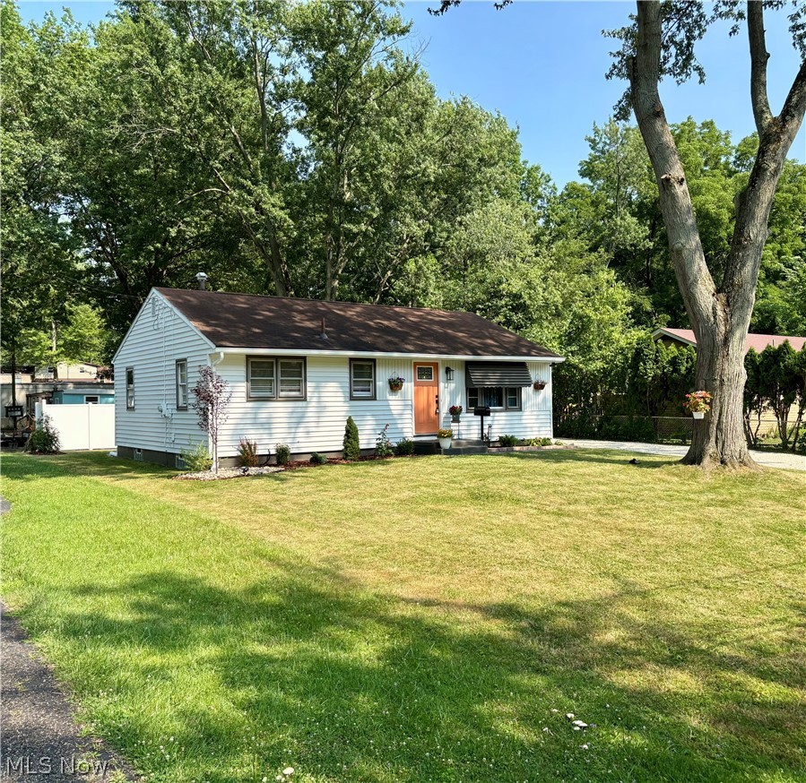Modernized ranch home with perfect blend of character and charm in Perry Township neighborhood. Kitchen is completely renovated with soft close  cabinets, 6 burner gas cook top, stainless refrigerator and dishwasher, quartzite counter and touchless faucet with quartz sink. Fully updated bathroom with stain master LVT flooring. All 3 bedrooms have new stain master carpet with warranty. LVP flooring in kitchen and living room. Interior and exterior have been freshly painted. Enjoy evenings entertaining in the newly fenced backyard. Extra wide driveway allows for ample parking. Move-in ready!
