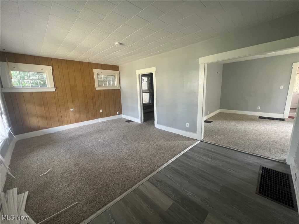 Calling all real estate investors looking for their first or next 2-unit value property! Looking for a light rehab to create force appreciation? This is the perfect investment for you! This duplex features TWO, two-bedroom, one-bathroom units, each with 836 sqft of living space. Each unit has newer flooring, kitchen, and countertops. Put your finishing touches on this property, then sit back and watch the cash flow come in! It is located in a quiet neighborhood just minutes from the Pro Football Hall of Fame, restaurants, and stadium park! Schedule your showing before it is too late!