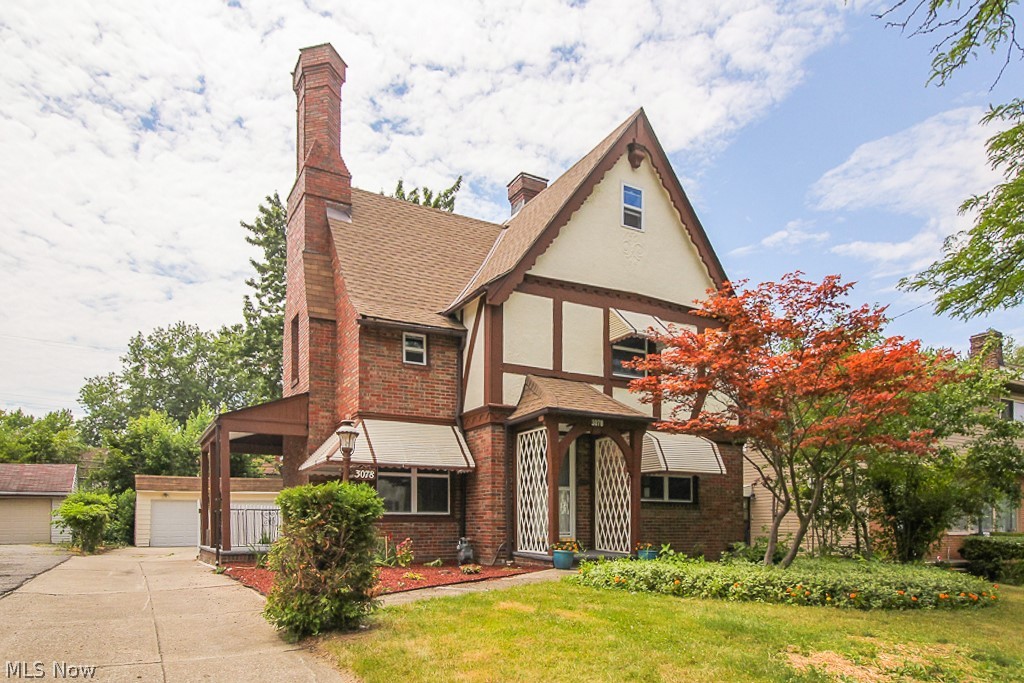 This lovely Tudor style brick home is beautiful inside and out! The home has been completely renovated & now offers the perfect marriage of historical charm & modern comforts. Upon entering you're find a lovely living room filled with warm light. The space flows naturally into the formal dining room & incredibly spacious kitchen. The brand new kitchen will be the pride of any food lover with granite countertops, modern white shaker cabinets and smoky gray glass subway tile! All throughout you'll find the thoughtful, high-end finishes that add touches of style to every room! Upstairs are 4 spacious bedrooms, 3 on the 2nd floor and the 4th in the large finished 3rd floor with walk-in closet that could make a private master bedroom, playroom or ideal home office! There are 2.5 bathrooms, each renovated with quality fixtures & stylish design. There is also a stunning exterior to this home: covered balcony & side porch, lovely landscaping, a white picket fenced surrounding the backyard, rea