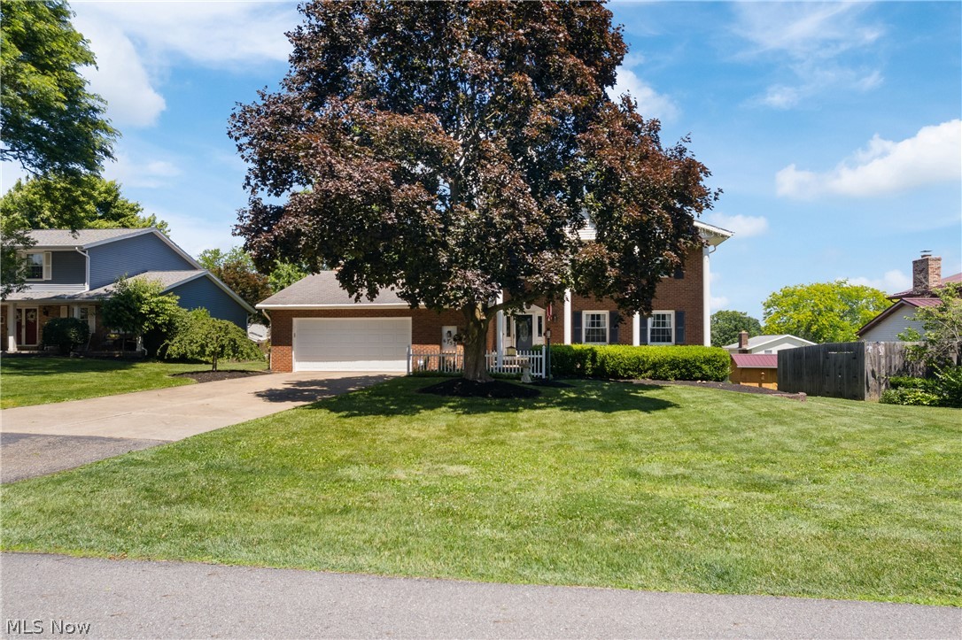 Stunning Brick Colonial – The One You've Been Waiting For!

Welcome to this beautifully updated brick colonial that perfectly blends timeless charm with modern style. From the moment you arrive, you'll be impressed by the outstanding curb appeal and inviting front porch—the perfect place to relax and unwind.

Step inside and immediately fall in love with the gorgeous hardwood floors that flow throughout much of the home, adding warmth, character, and easy maintenance. The open-concept kitchen, dining, and living area is designed for entertaining, offering plenty of space for gatherings large and small. The living room is truly a showstopper, featuring a stunning gas fireplace surrounded by custom built-in shelving that creates a warm and inviting focal point.

In addition to the open living space, the home offers a formal dining room and a separate family room, providing flexibility for everyday living and special occasions. A beautifully updated half bath and convenient first-floor laundry complete the main level.

Upstairs, you'll find four spacious bedrooms, including a relaxing owner's suite, along with a second full bathroom. The full basement offers endless possibilities for a home gym, recreation room, theater room, workshop, or additional storage.

Step outside through the sliding glass doors off the kitchen and enjoy your private back deck, complete with a retractable awning—perfect for enjoying summer days in comfort while staying out of the direct sun.

This home offers the space, updates, and features today's buyers are looking for. Don't miss your opportunity to see it in person—schedule your private showing today!