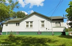 Updated home sitting on a private corner lot with lots of surrounding land. Home features a new kitchen with new white cabinets, back splash, and appliances. Other updates include bathroom, flooring, roof, electric, plumbing, replacement windows, and glass block windows in the basement. One floor living with large master bedroom, and 2nd guest bedroom, living room , dining room, front and back porches are  enclosed Full basement with laundry room, rec room and lots of storage. 5 lots go with this property! Wonderful open space and sets on corner of Jacobs Rd & Orrin.   2 car Garage is currently still standing and locked up for safety, but will be torn down soon. So nice to NOT have neighbors too close! 5 beautiful lots, manicured, grass and a few trees!